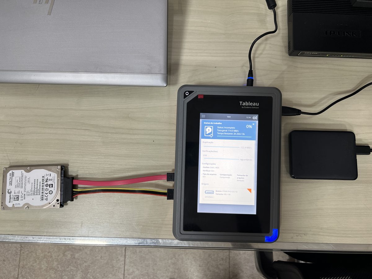 Tableau TX1 forensic imager connected to a hard drive during a write-blocked acquisition at the Enetsec laboratory